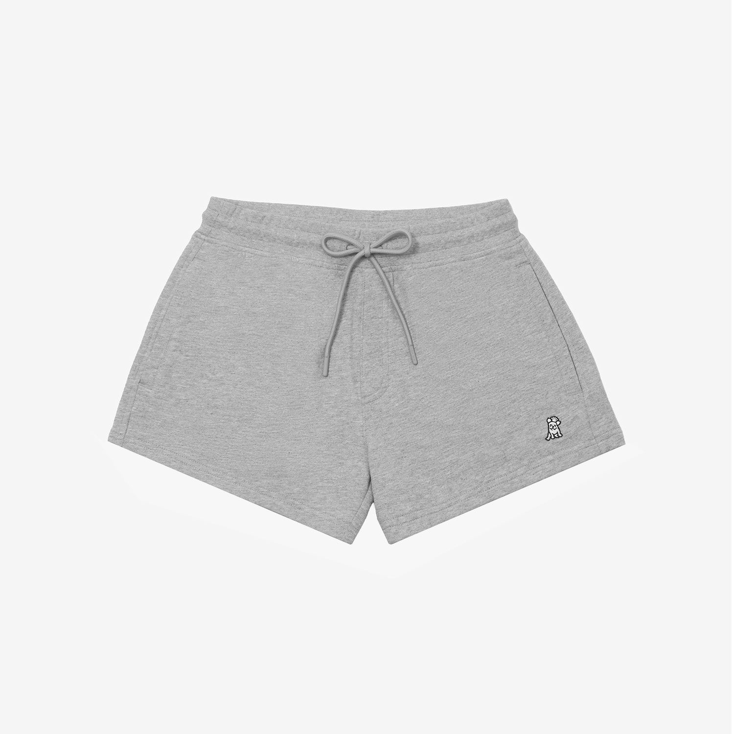 Gray shorts laid flat with an elastic waistband, drawstring, and a small embroidered logo on the lower left side