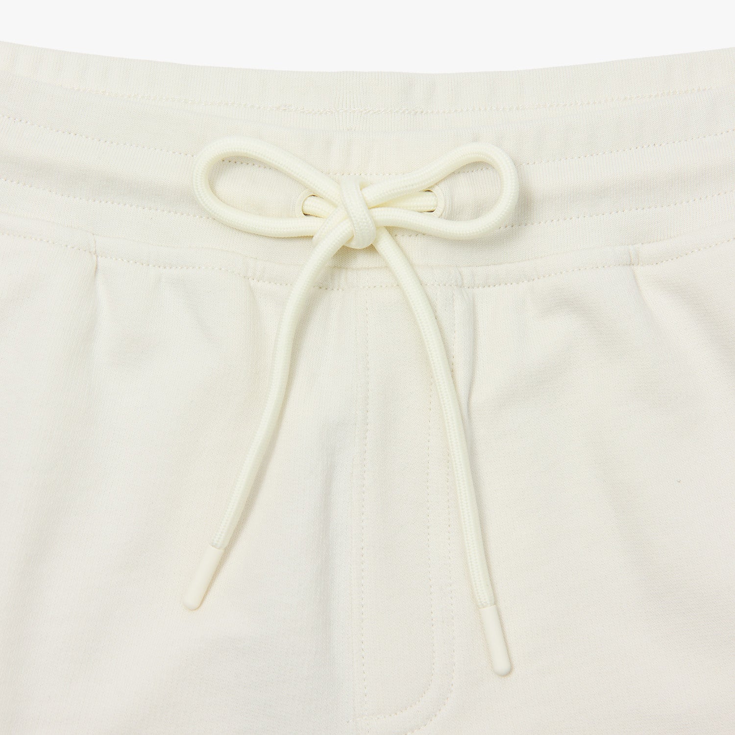 Highlights the elastic waistband with a neatly tied drawstring.