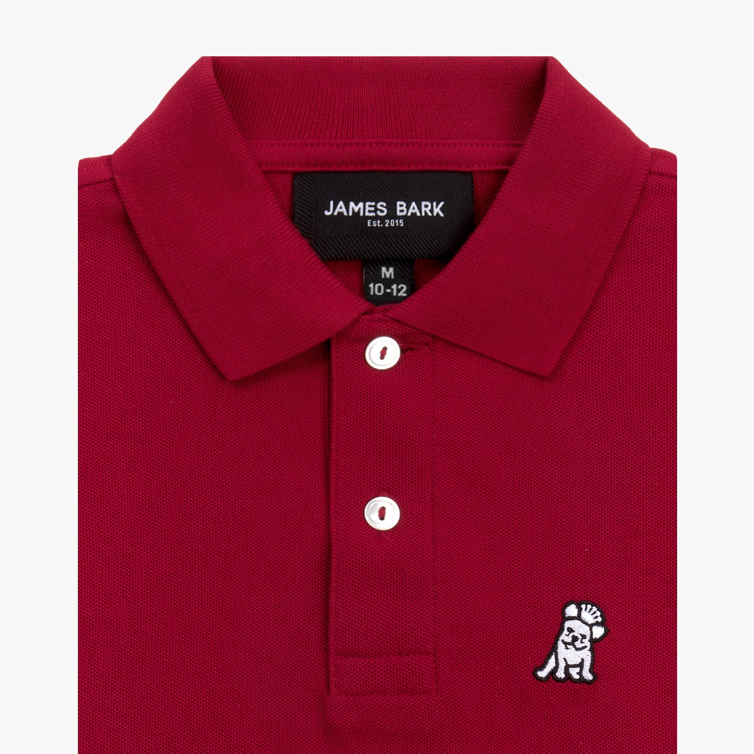 Close-up of the collar and chest area of the red polo shirt, showing the button placket and embroidered logo.