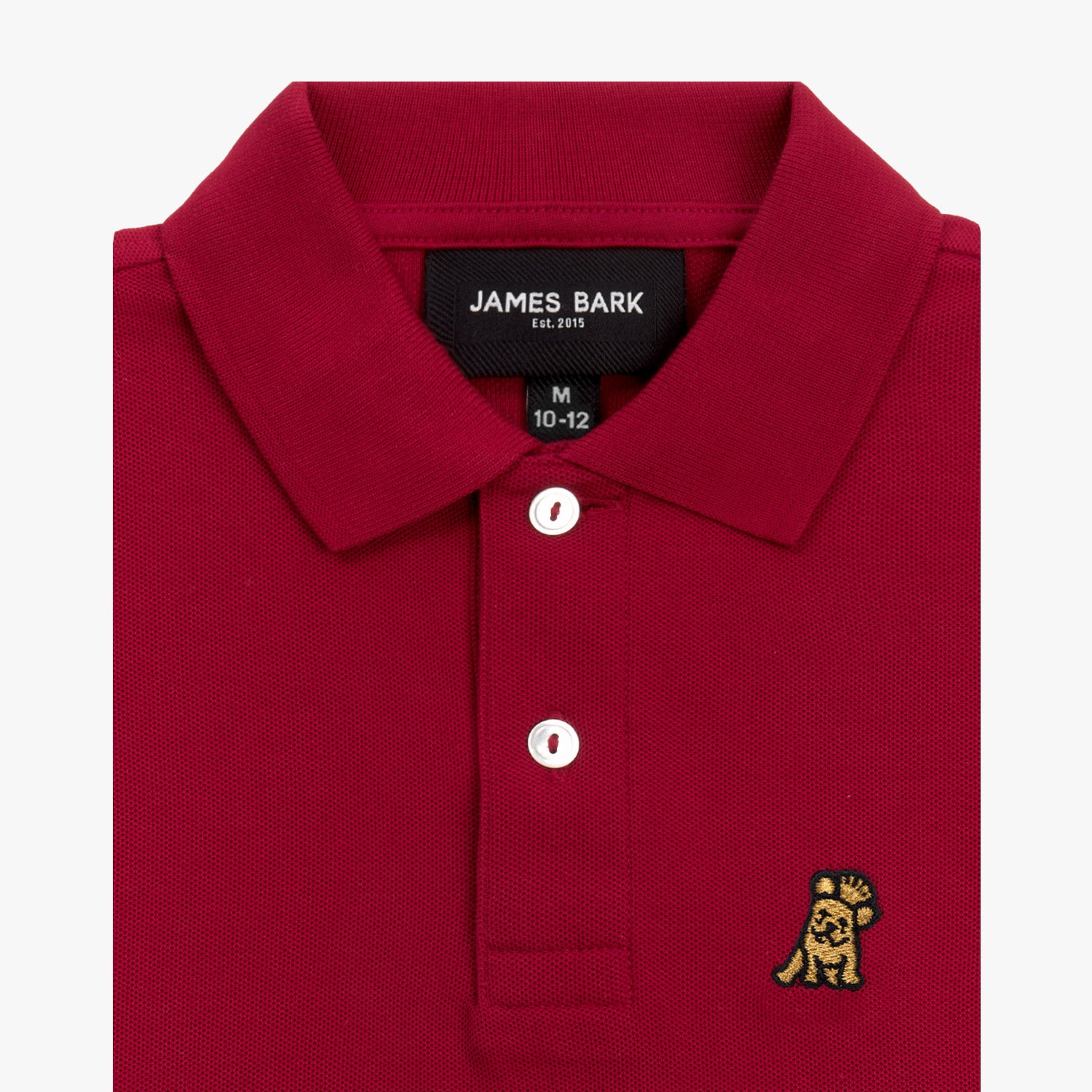 Close-up of the collar and chest area of the red polo shirt, showing the button placket and embroidered logo.