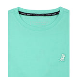 Close-up of the collar area of the mint green t-shirt, showing the small white embroidered logo on the chest.