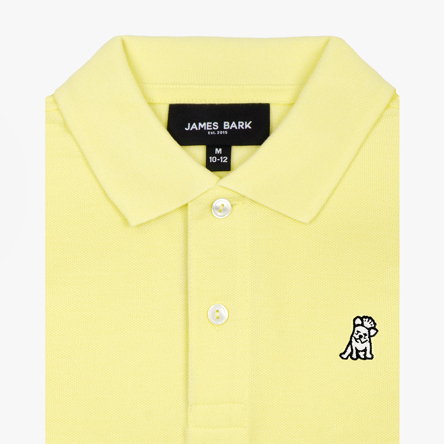 Close-up of the collar and chest area of the yellow polo shirt, showing the button placket and embroidered logo.