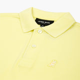 Close-up of the neckline and collar of the yellow polo shirt, showing the button details.