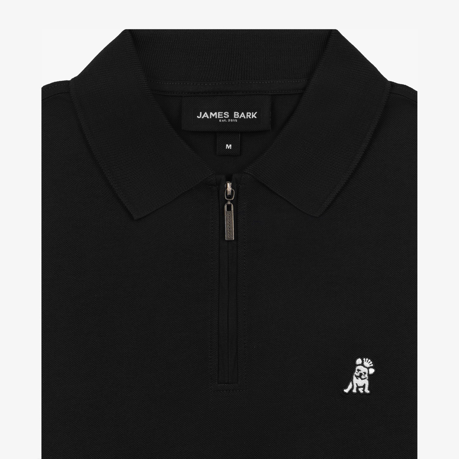 Close-up view of the black polo shirt collar and zipper, showcasing the embroidered silver logo.