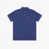 A full-body image of a male model wearing the James Bark royal blue polo shirt paired with beige pants and sneakers, standing in a casual pose against a white background