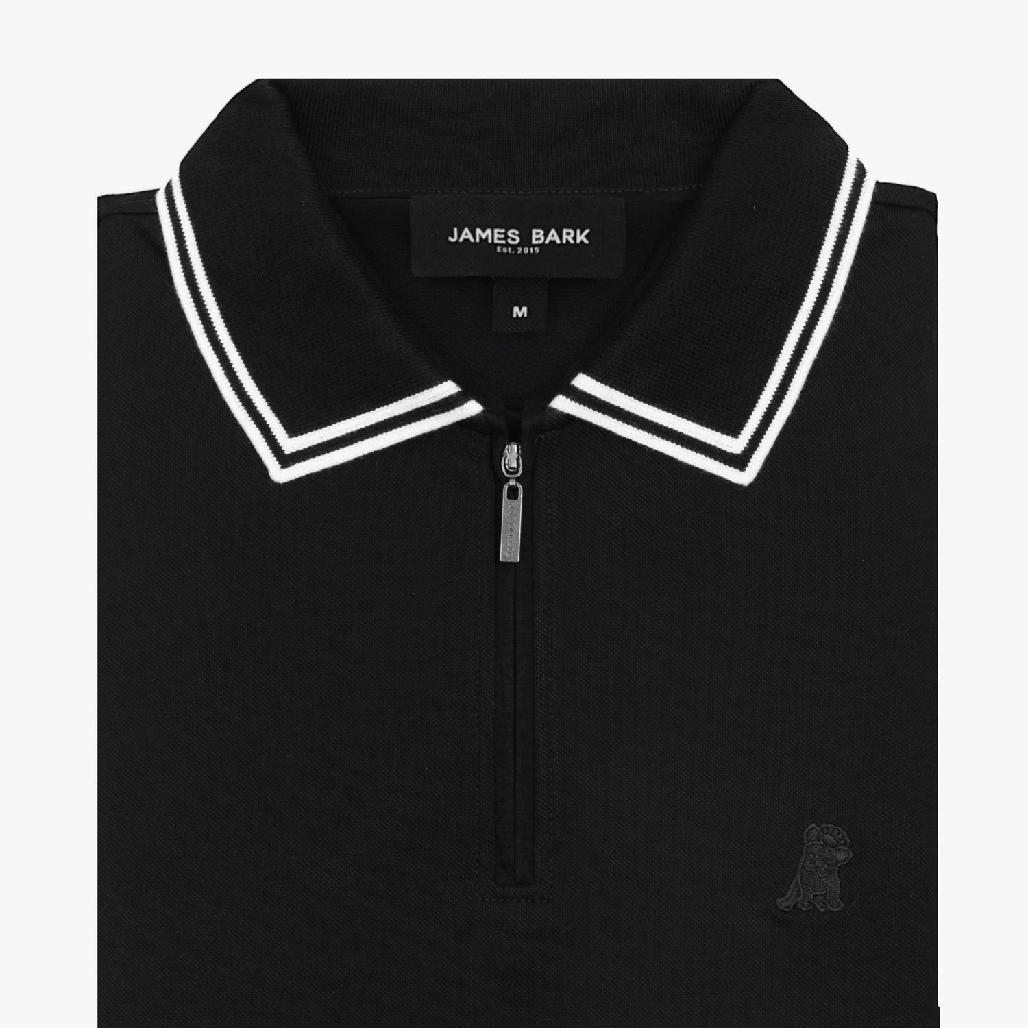 Flat lay of a black polo shirt with white trim on the collar and sleeves.