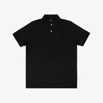 Polo in navy blue laid flat on a white surface, displaying the front with the embroidered logo and buttons.