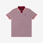 A striped polo shirt featuring a micro-stripe pattern in burgundy and white. The ribbed collar is deep burgundy with a contrasting soft pink stripe along the edge. The open placket adds a modern and relaxed touch. The sleeves have matching pink and burgundy ribbed cuffs for a cohesive design. A tonal rubberized dog logo is subtly placed on the left chest, maintaining the shirt’s minimalist and refined aesthetic.