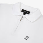 Flat lay of the white polo shirt, showing the logo on the left chest and the zipper design.