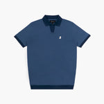 A navy blue polo shirt from "JAMES BARK" with a contrasting darker blue ribbed collar and sleeve cuffs. The shirt features a V-neck opening without buttons, giving it a modern and sleek look. A small white embroidered dog logo is placed on the left chest. The fabric appears textured, and the hem is finished with a matching dark blue ribbed band for a refined touch.