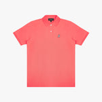 Coral polo shirt with a small logo on a light gray background