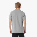 Man wearing a gray polo shirt on a white background