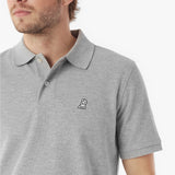 Gray polo shirt with a small logo on a white background