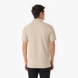 Back picture of a man wearing a beige polo shirt on a white background