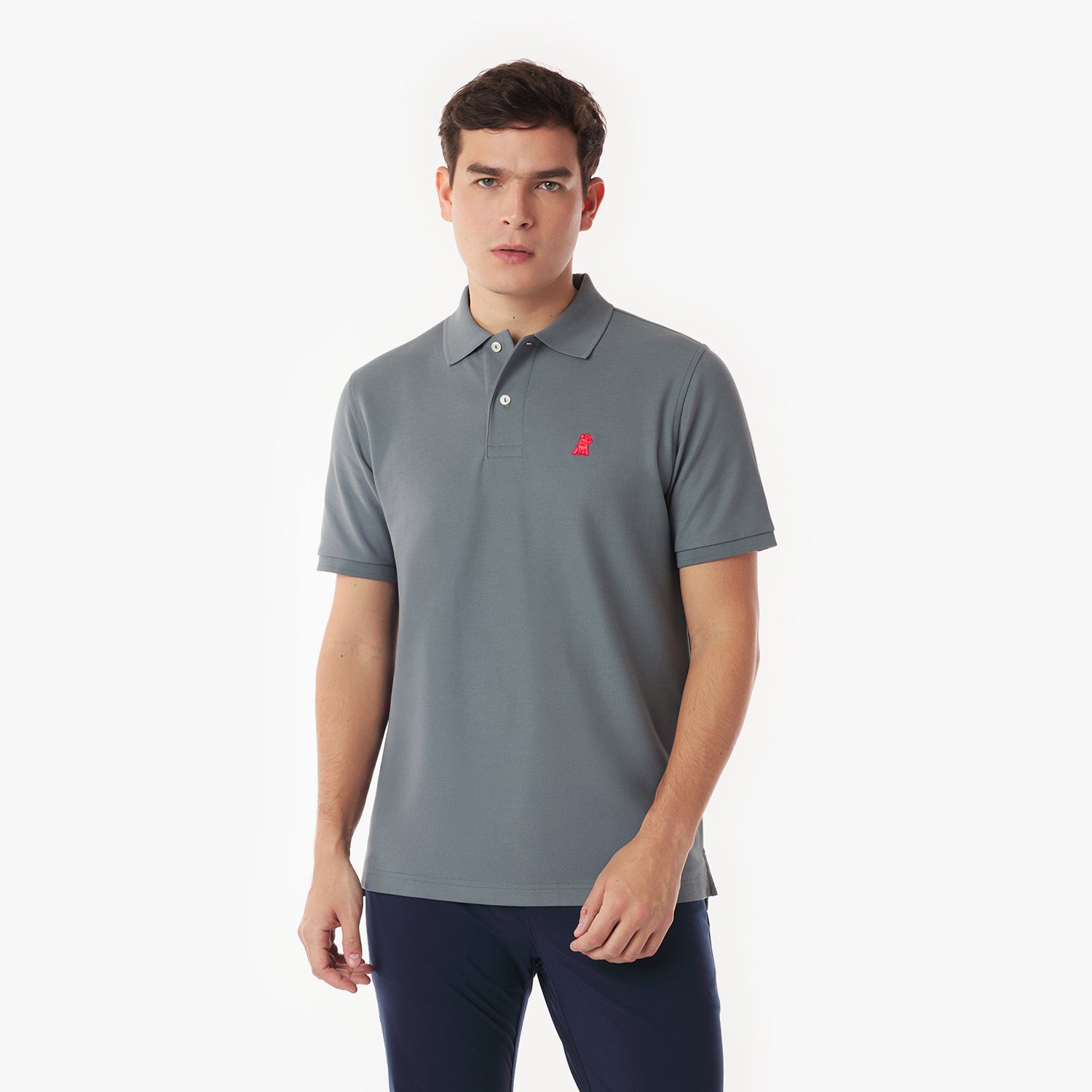 Man wearing a gray polo shirt with a red logo on a white background