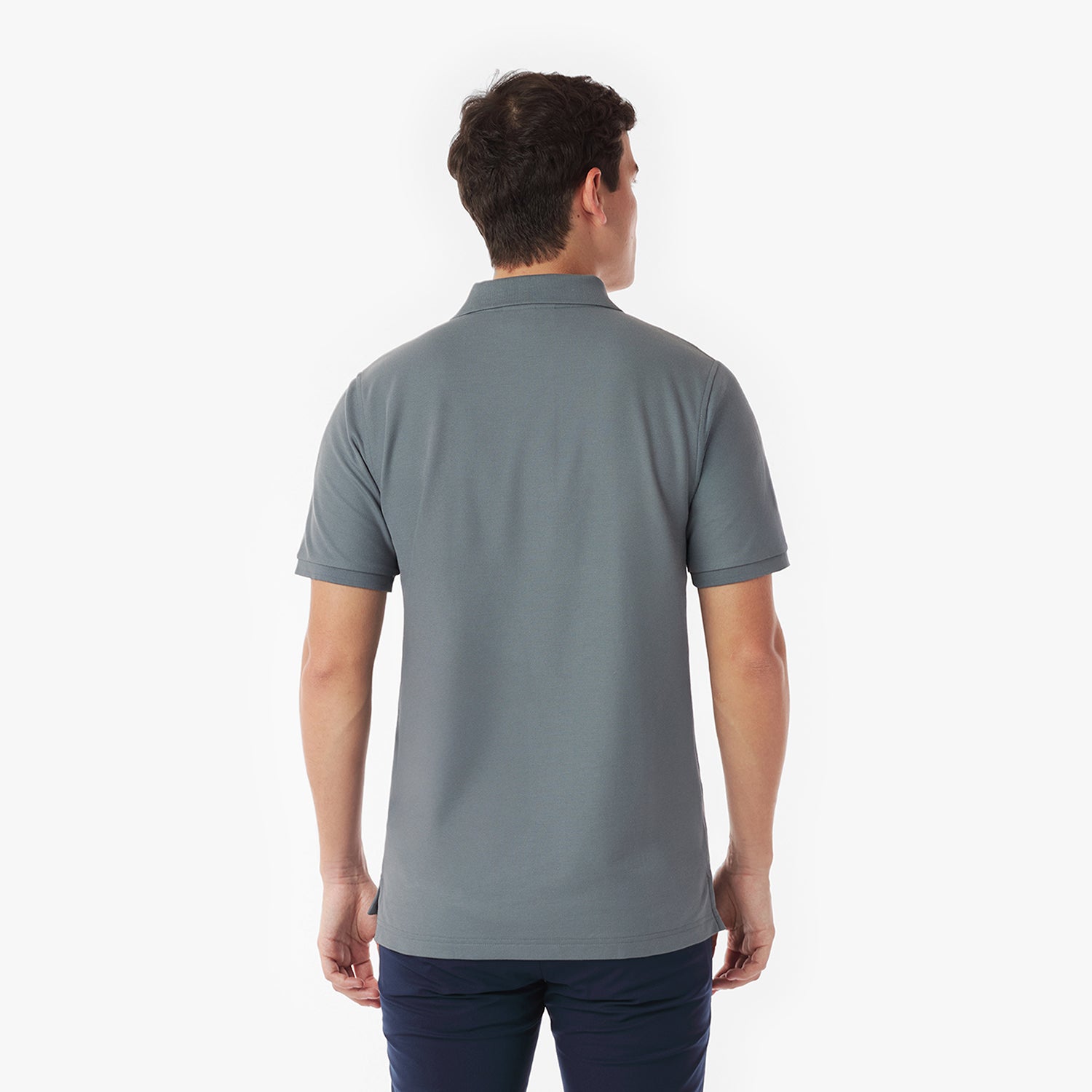 Back picture of a man wearing a gray polo shirt on a white background