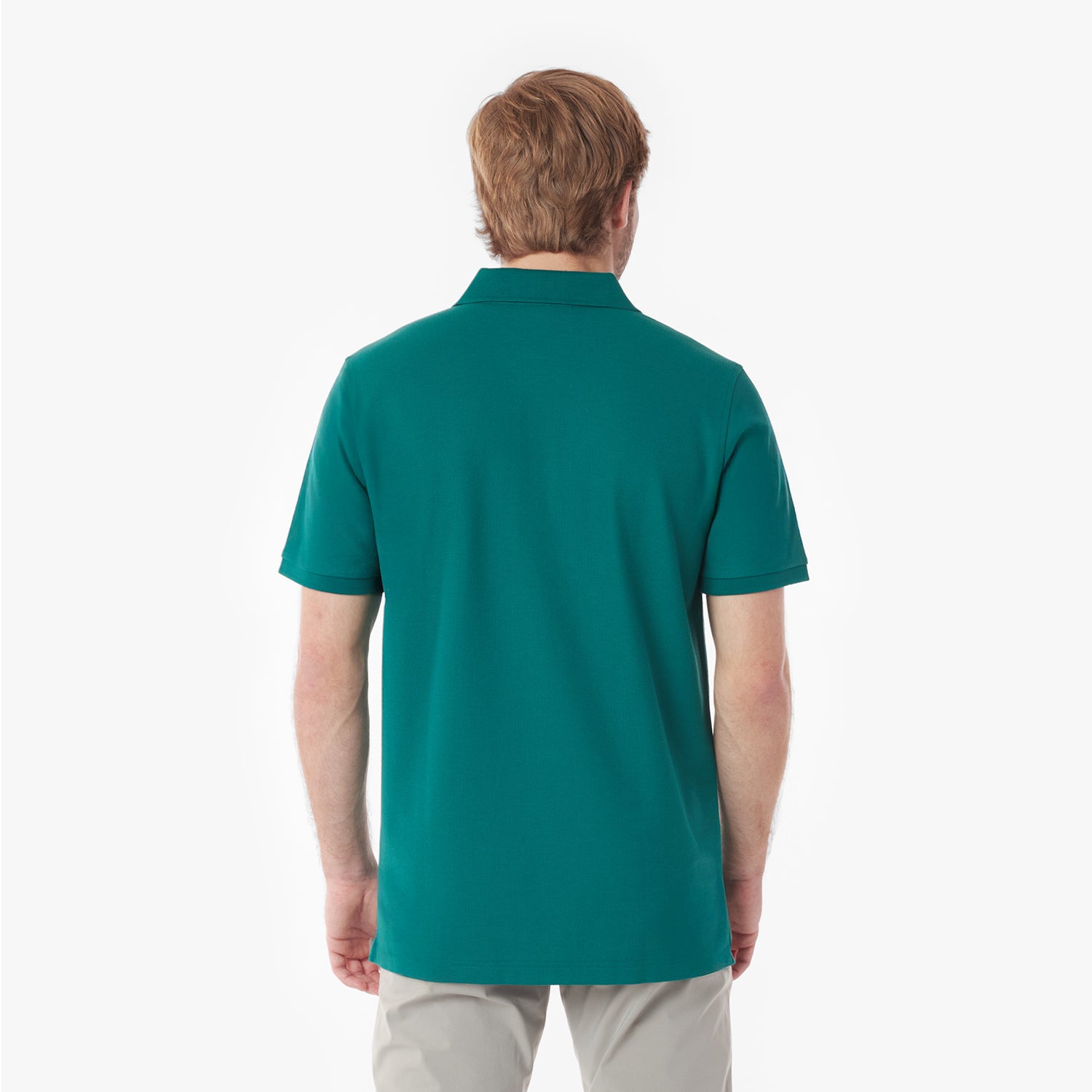 Back picture of a man wearing a teal polo shirt on a white background