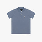 A dusty blue polo shirt with a three-button placket and a small embroidered dog logo on the left chest, displayed flat against a light gray background.