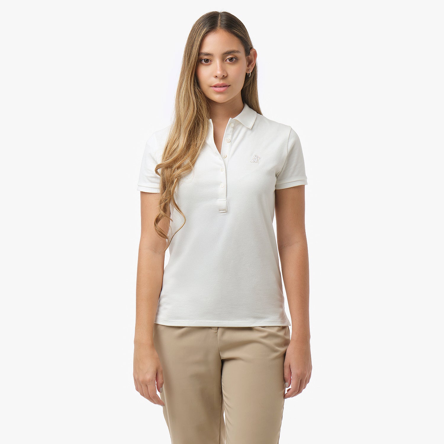 Woman models an off-white short-sleeve polo shirt with matching buttons and logo, paired with beige trousers. Front view against white background