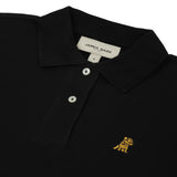 Flat-lay front view of the black polo shirt showing the buttoned collar and gold embroidered logo.
