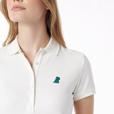 Close-up of a white polo shirt with a small logo on a white background