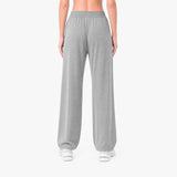 Person wearing gray sweatpants on a white background