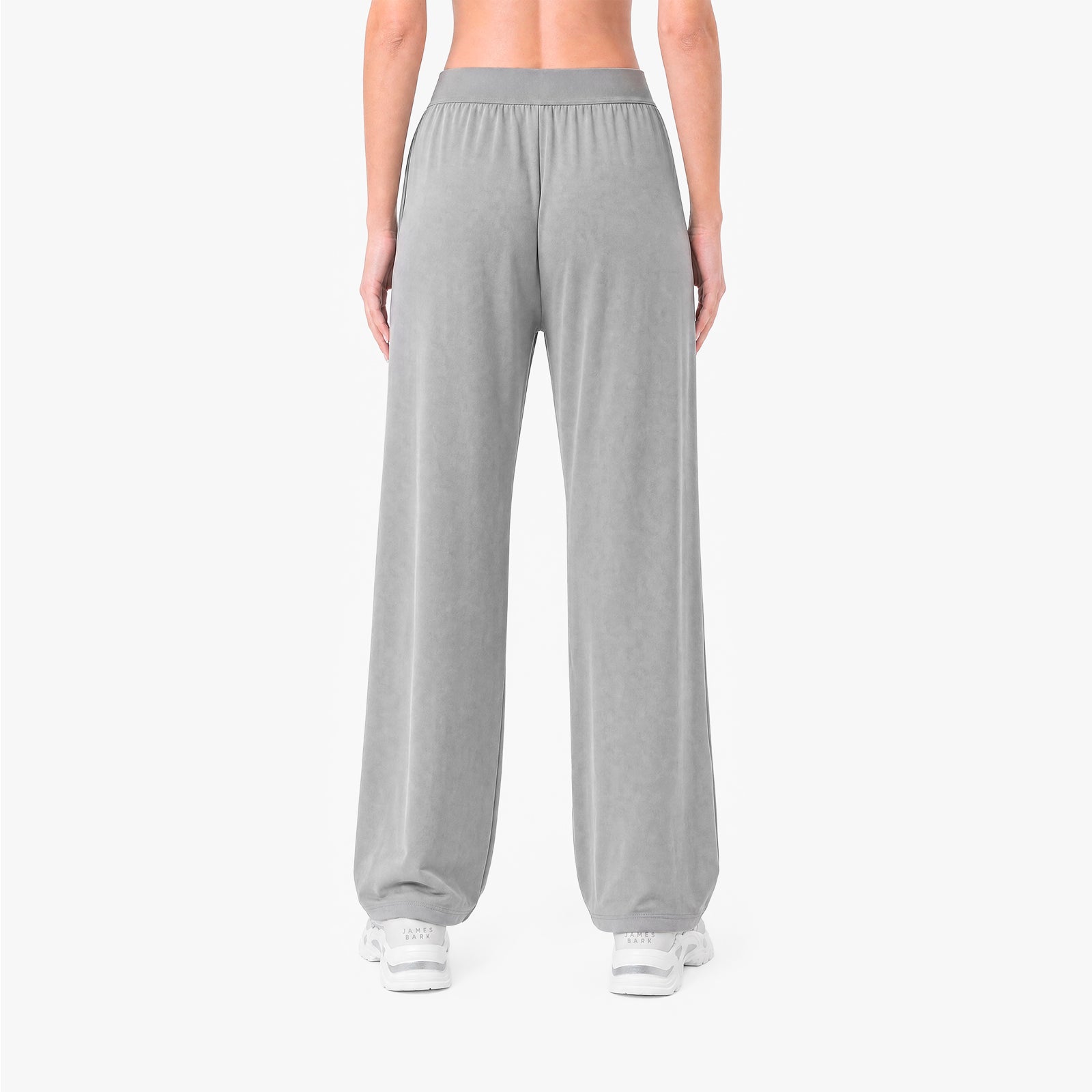 Person wearing gray sweatpants on a white background