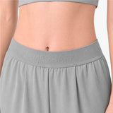 Gray athletic pants with 'James Bark' branding on a plain background