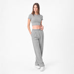 Woman wearing a gray outfit on a white background
