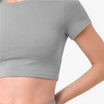 Gray athletic shirt worn by a person on a white background
