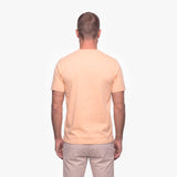 Man wearing a beige t-shirt on a white background