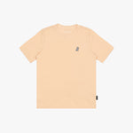 A light peach T-shirt with a small embroidered logo on the left chest, displayed flat against a white background.