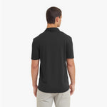 Man wearing a black polo shirt on a white background