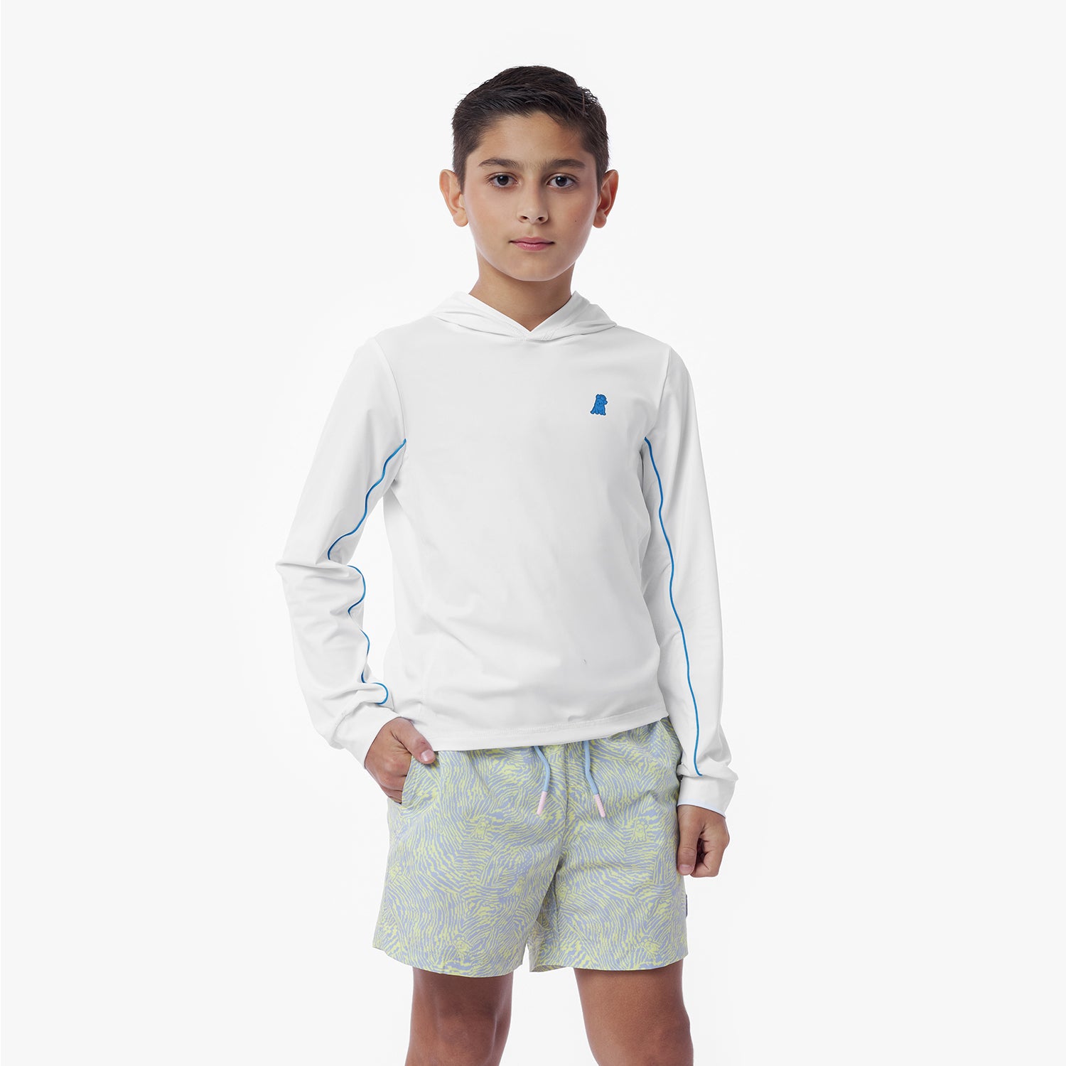 Child wearing a white hooded rashguard with blue accents and light-colored shorts on a white background