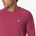 Close-up of a maroon long-sleeve rashguard with a small logo