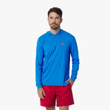 Man wearing a blue rashguard and red shorts