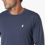 Close-up of a navy long-sleeve rashguard with a small white logo