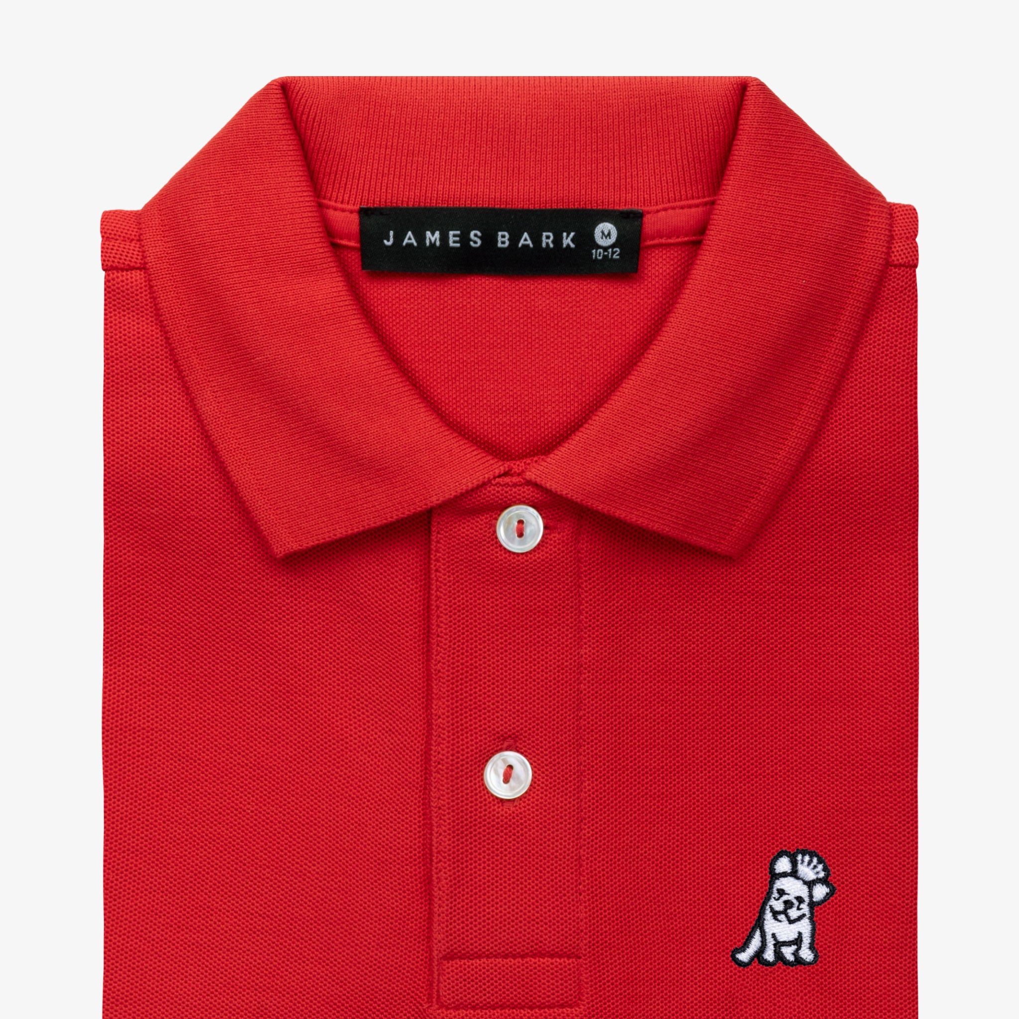 Close-up of the collar and chest area of the red polo shirt, showing the button placket and embroidered logo.