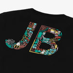 Close-up of the back of the black t-shirt, showing the "JB" lettering with a colorful pattern.