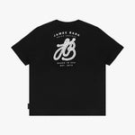 Flat lay of the black T-shirt, showing the large decorative 'JB' logo and 'James Bark' text on the back.