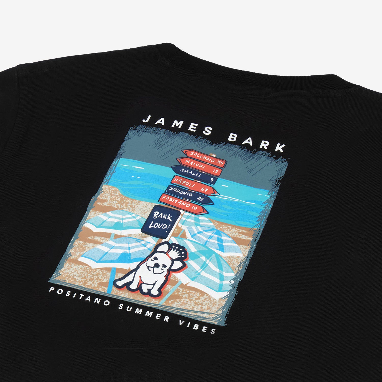 Close-up of the back of the black t-shirt showing the beach-themed graphic with a dog and stacked items.