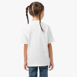 Back view of a young girl wearing a white t-shirt and jeans, showing the back of the shirt.