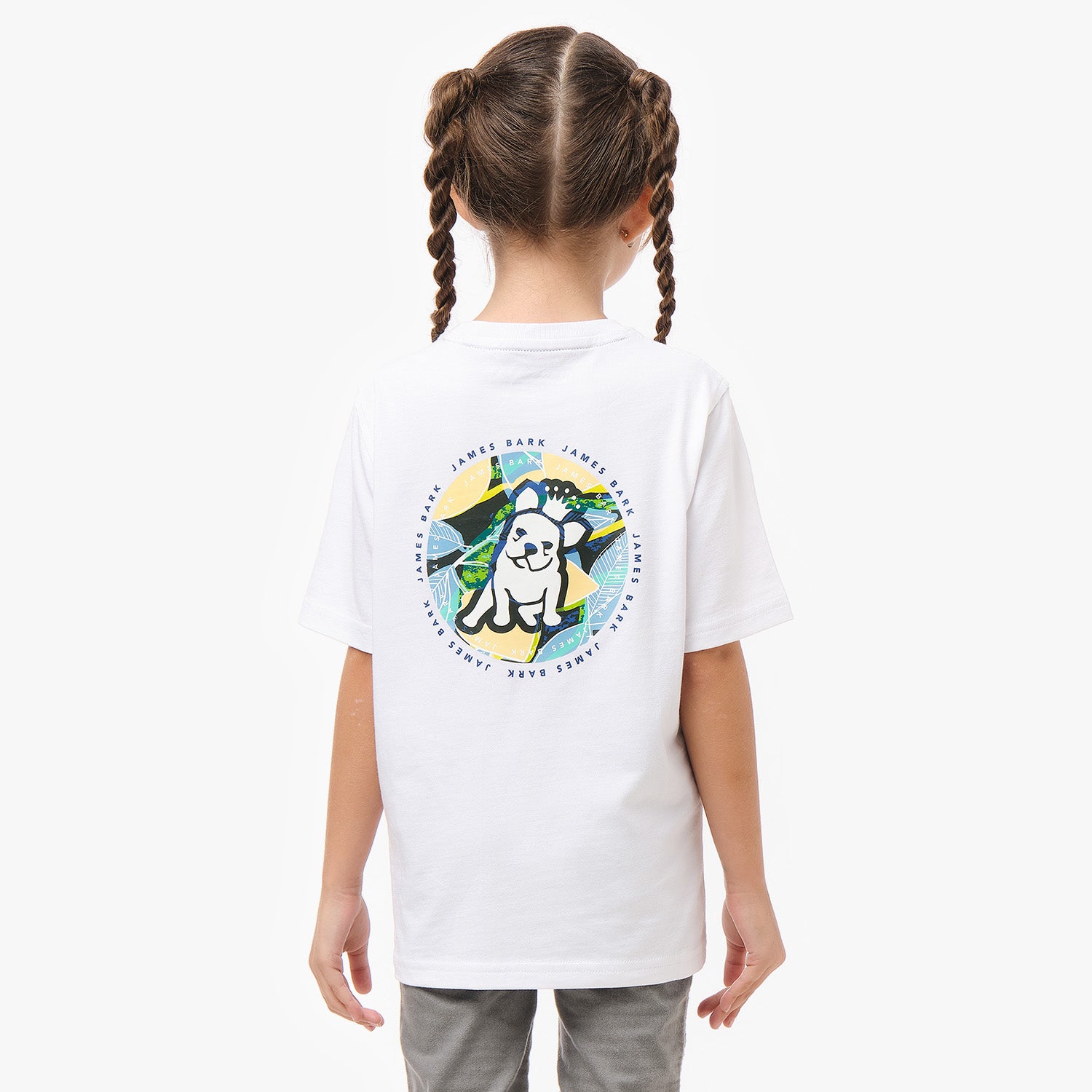 Back view of a girl wearing a white T-shirt, showcasing the colorful circular dog graphic on the back.