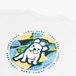 Close-up of the back graphic on a white T-shirt, showing a dog wearing sunglasses in a colorful circular design with text around it.