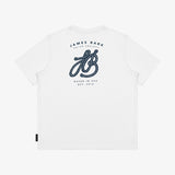 Flat lay of the white T-shirt, showing the large decorative 'JB' logo and 'James Bark' text on the back.