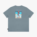 Flat-lay view of the gray t-shirt showing the back with the large beach-themed graphic and dog illustration.