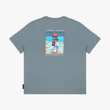 Flat-lay view of the gray t-shirt showing the back with the large beach-themed graphic and dog illustration.