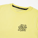 Flat lay of the back of the yellow T-shirt.