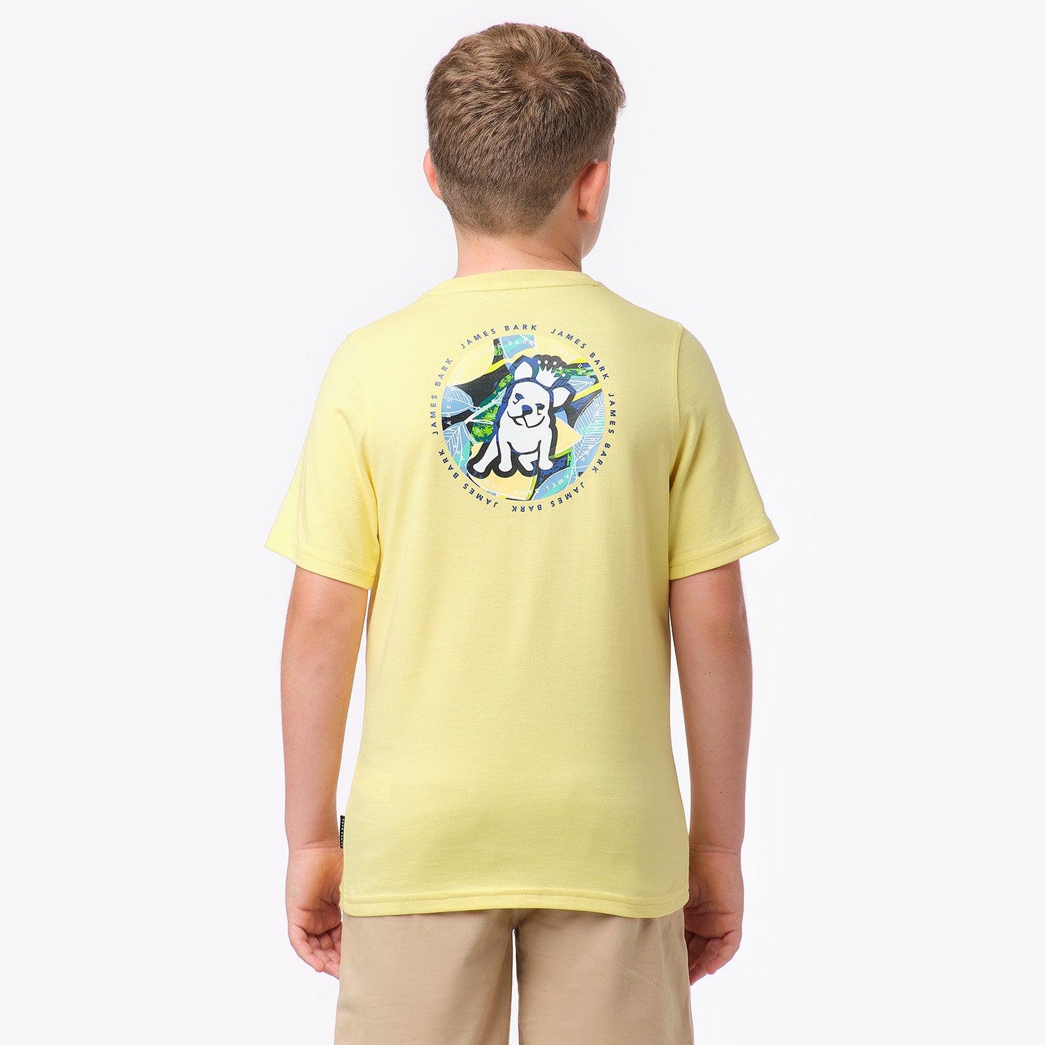 Back view of a yellow T-shirt featuring a colorful graphic of a dog with sunglasses in a circular design on the back.