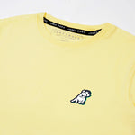 Close-up of the back graphic on the yellow T-shirt, showing a dog wearing sunglasses in a colorful circular design with text around it.